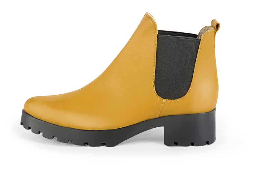 Mustard yellow and matt black women's ankle boots, with elastics. Round toe. Low rubber soles. Profile view - Florence KOOIJMAN